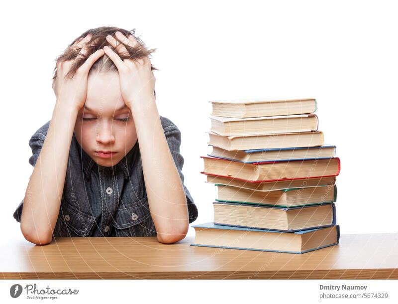 Frustrated child with learning difficulties 10 years Classroom Homework book boy caucasian challenge childhood closed eyes depressed desk difficulty displeased