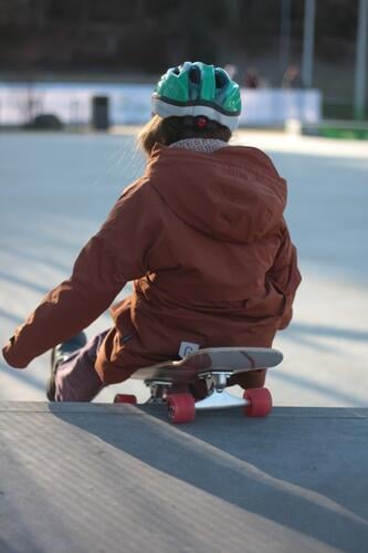 Surfskateboarding in a sitting position Child surfskateboard Skateboard Helmet Skate park fun seated out Cold Roll
