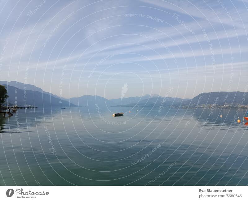 Tranquil summer atmosphere with a boat on Lake Attersee in the sunshine Summer Vapor trail Haze sheep's mountain mountains Salzkammergut reflection Landscape