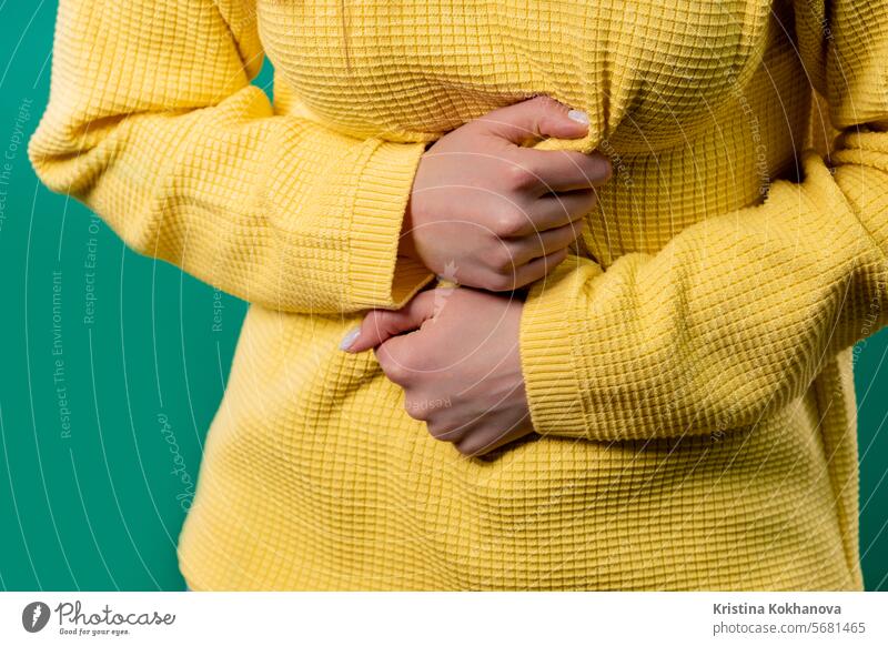 Woman squeezing belly with hands. abdominal pain. Lady suffering stomach ache abdomen adult asian background beautiful bed care constipation cramp diarrhea