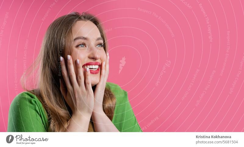 Amazed woman, she expresses WOW. Impressed pretty lady, copy space on pink excited female scream caucasian isolated surprise wow amazed funny shocked girl