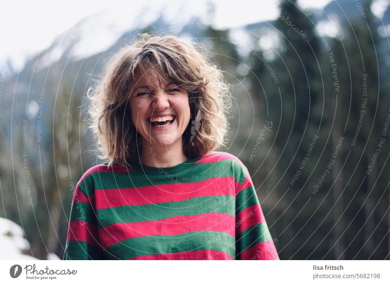 LAUGHTER - MOUNTAINS - JOIE DE VIVRE Woman 30 - 40 years Blonde Curl Laughter Closed eyes Mountain trees beautiful teeth Fresh youthful Joie de vivre (Vitality)