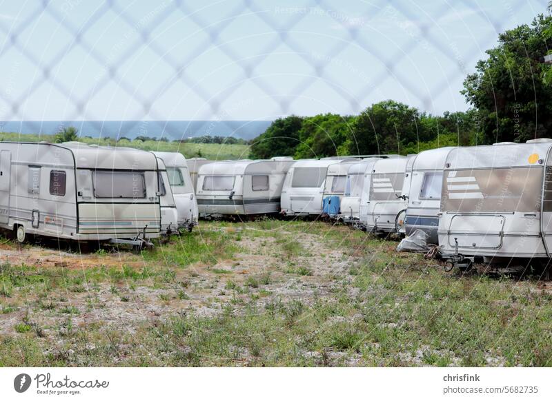 Caravan depot behind fence trailer caravans Mobile home vacation travel holidays Life dwell Vacation & Travel Mobility Camping site Tourism Freedom