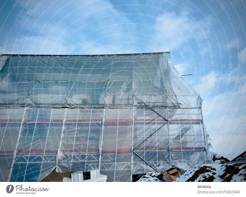 Construction site | Shrouded house in front of a blue sky with clouds House (Residential Structure) Tarp Scaffold construction net construction foil Net