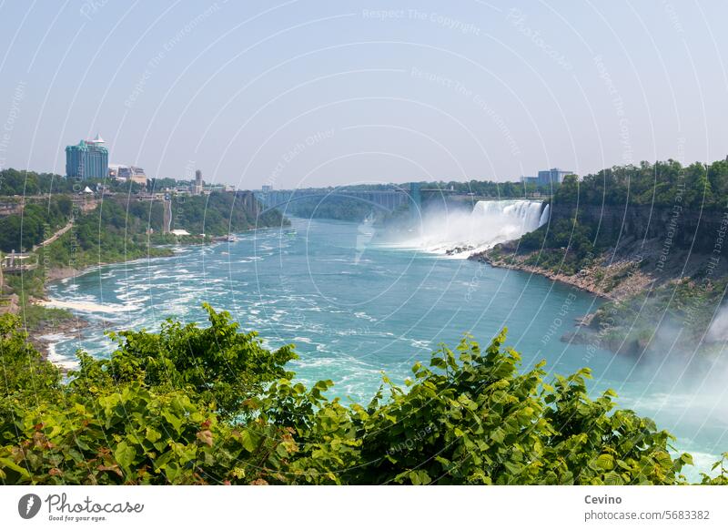 Niagara Falls Niagara Falls (USA) niagara if Niagara river Canada vacation Tourism tourist region Water Waterfall Sightseeing boat Boating trip Dangerous peril