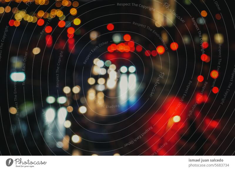 street lights at night in the city colors colorful multicolored bokeh circles bright shiny blur blurred defocused outdoors abstract pattern background textured