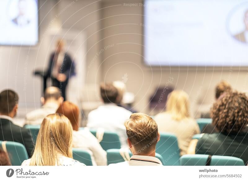 Coaching event, business conference and presentation, professional training or workshop life coaching public speaker rear view public speaking audience people