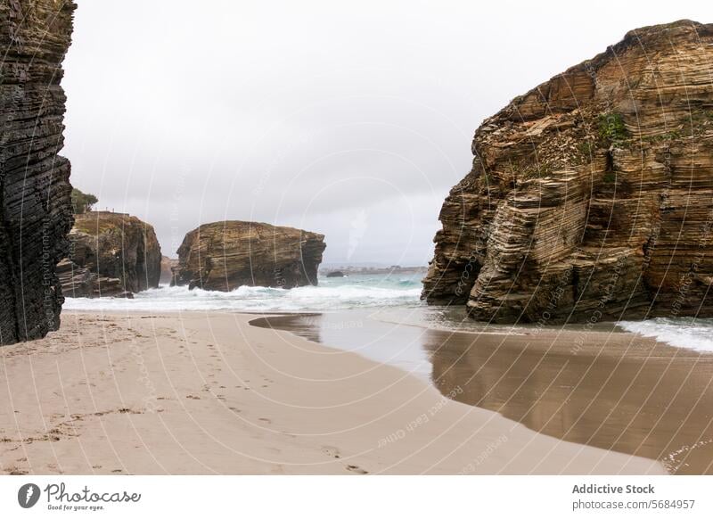 Majestic cliffs at Playa de las Catedrales beach in Spain spain cantabrian sea rock formation sand wave shore layered majestic coastal landscape travel tourism