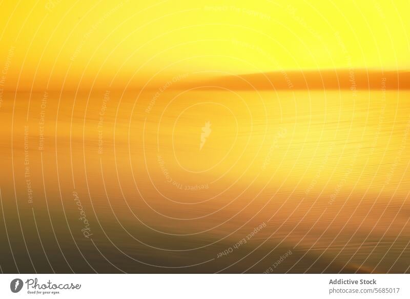 Golden sunset abstraction on water golden glow tranquility horizon soft waves reflection serene nature dusk evening calm peaceful backdrop background blur warm