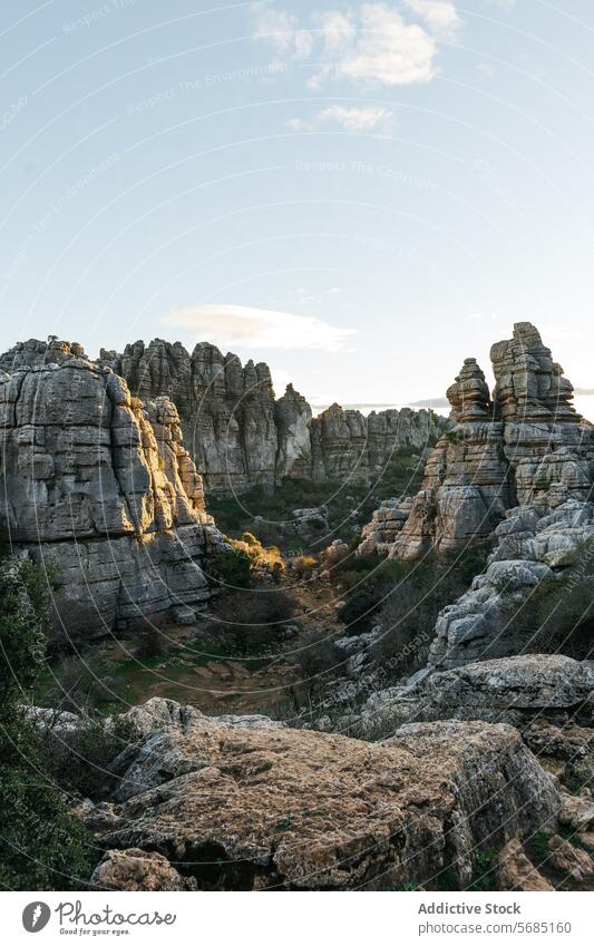 Golden sunlight bathing the unique karst formations at Torcal de Antequera during sunset golden hour Malaga nature landscape rock scenic geological travel