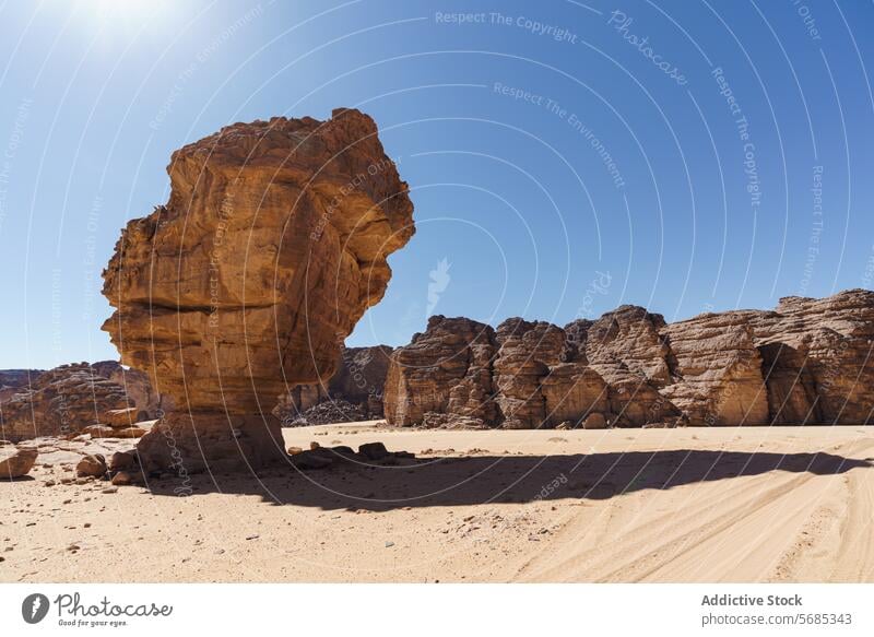 Majestic rock formations in the Tadrart Rouge desert natural sculpture blue sky striking grandeur algeria imposing landscape nature geological erosion sand arid