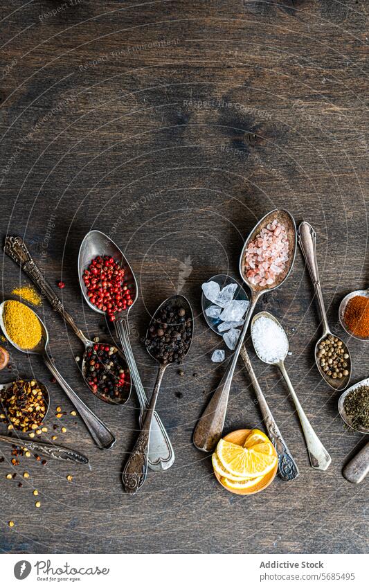 Assorted spices and seeds in spoons on rustic wood food flatlay colorful ingredient cooking culinary variety arrangement wooden sunflower anise rosemary mint