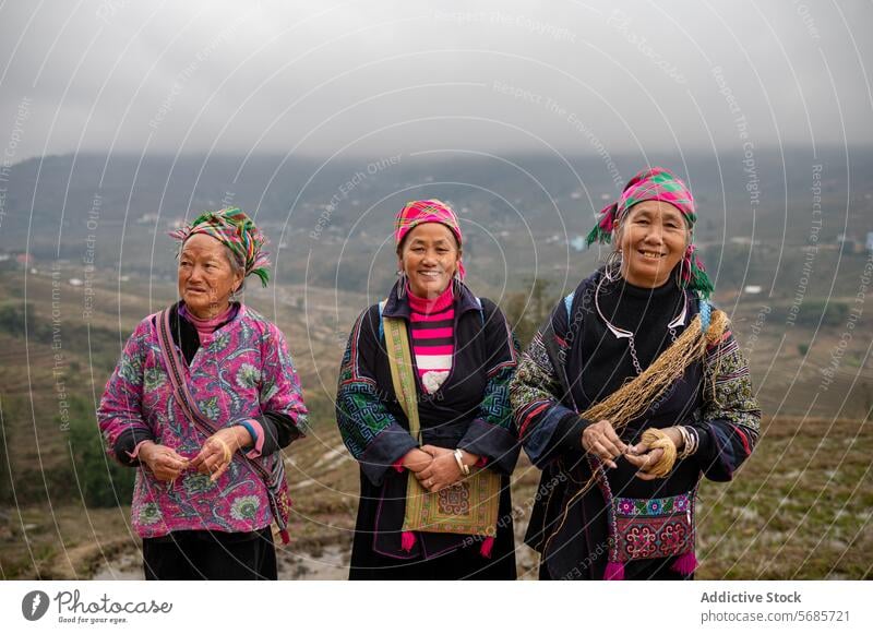 Smiling Asian women with traditional clothes standing in rural valley village smile mountain countryside local happy culture glad highland positive range peak