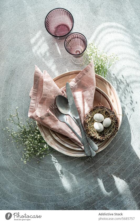 Elegant Easter Table Setting with Spring Charm table setting easter eggs bird's nest china pink linen spring celebration elegant simple soft delicate speckled