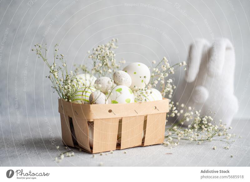 Easter eggs with delicate gypsophila in a wooden basket easter decorated celebration spring holiday design gray background festive sprig floral tradition