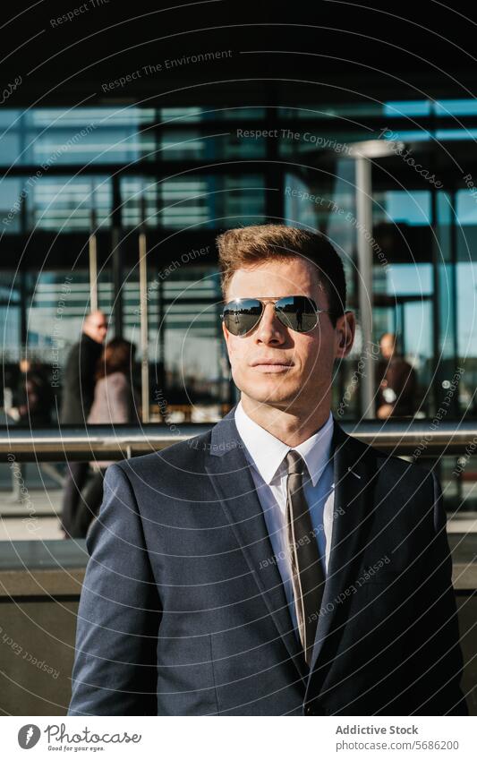Confident businessman in Madrid with modern backdrop madrid spain building glass sunglasses confidence dress suit tie professional corporate city urban male