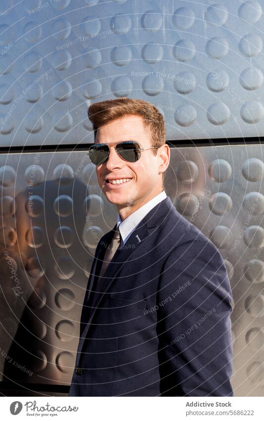 Stylish businessman enjoying sunlight in Madrid style madrid smile sunglasses suit modern wall textured sharp dress young male professional fashion businesswear