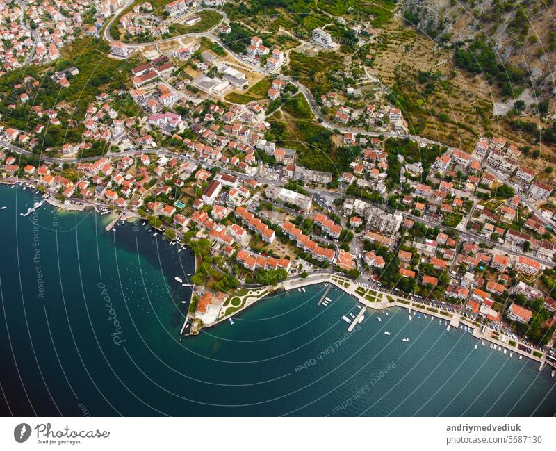 Aerial drone high view of Kotor bay, Boka Kotorska and coastal town Kotor, Cattaro, in Montenegro. Location place famous resort Montenegro. Adriatic fjord surrounded by rugged mountains