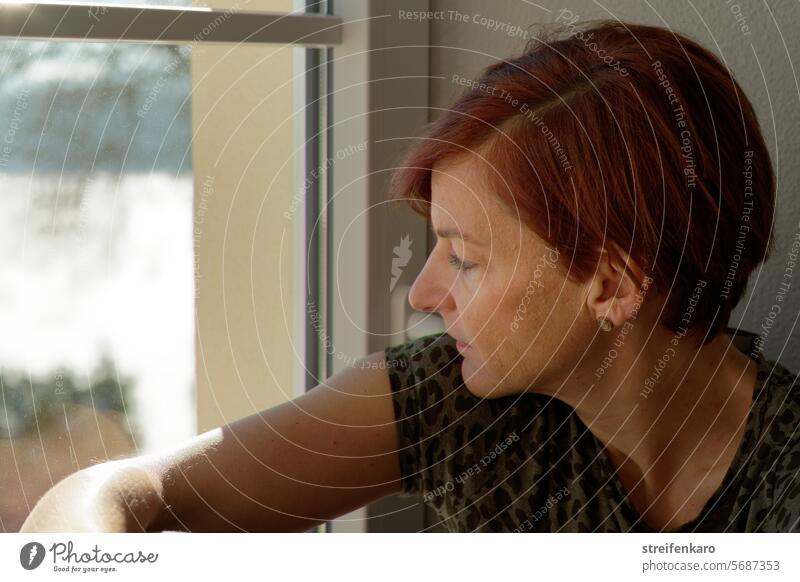 Thoughtful look out of the window Woman feminine portait side view Window Face Adults Close-up pretty Moody Authentic naturally Looking Meditative