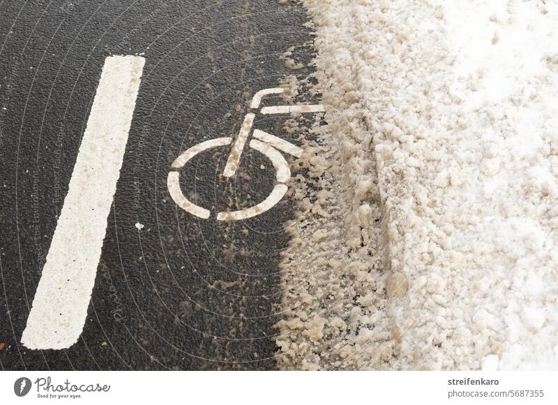 No chance for cyclists! Snow Winter Street cycle path Cycle path Lane markings Asphalt waypoint evacuated Cleared road Transport peril Dangerous Disadvantage
