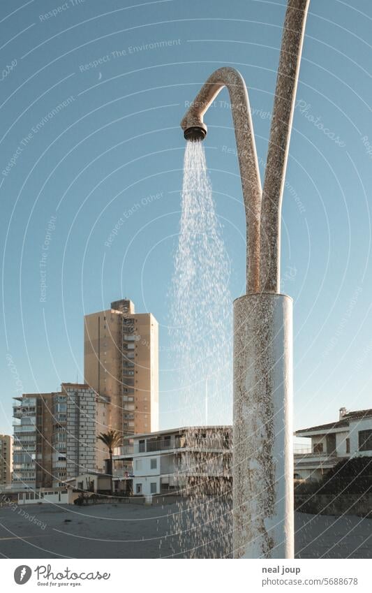 Beach shower in front of urban beach houses of various styles Architecture coast Beach hut High-rise Anonymous Shower Water Refreshment Drops of water rusty
