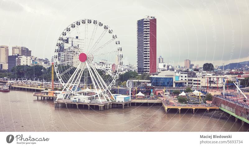 Aerial view of Guayaquil waterfront panorama, color toning applied, Ecuador. city cityscape skyline aerial ferris wheel building toned filtered river ecuador