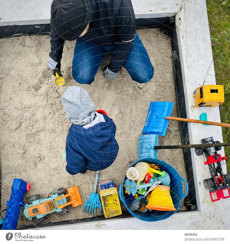 Man and child playing in a sandpit sandbox Child Playing Toys Father parental leave free time Infancy Parents dad Sand Happy Family people Garden Shovel Rake