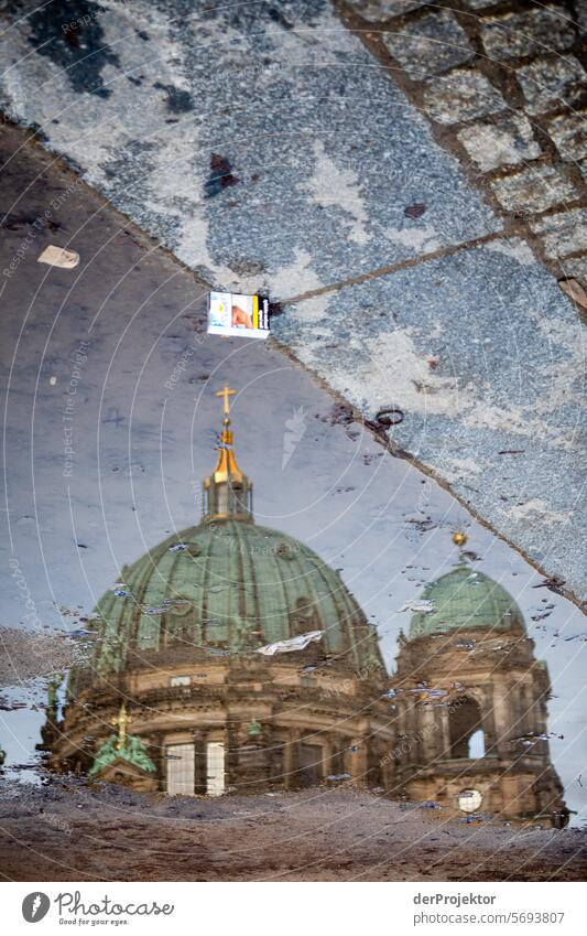 Berlin sights in the puddle I Winter real estate dwell Copy Space top Downtown Berlin Capital city High-rise Urbanization Copy Space right Copy Space left