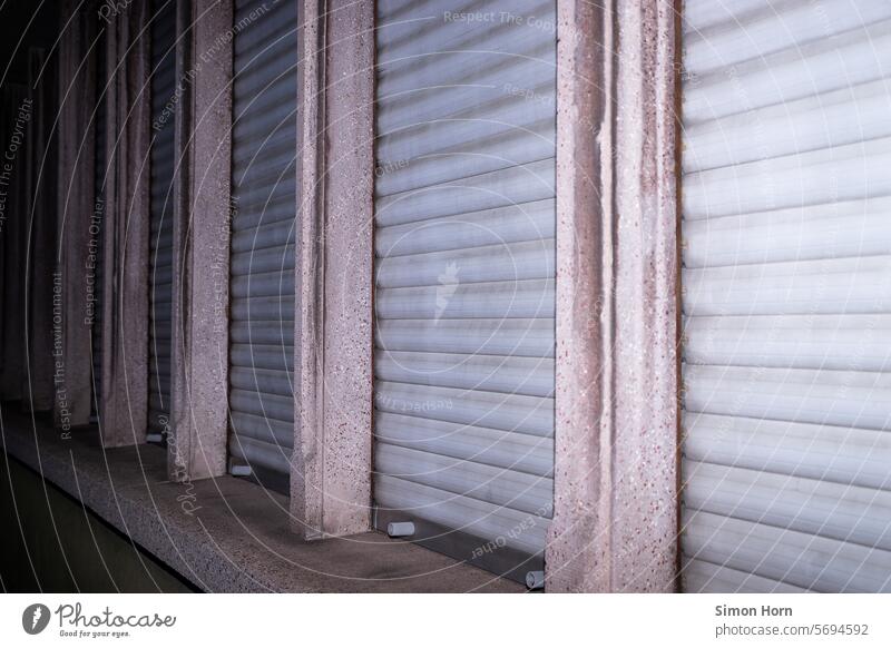 Window row with closed shutters Row row of windows Closed barricaded Roller blind Roller shutter slats Structures and shapes Screening Gray lines Side by side