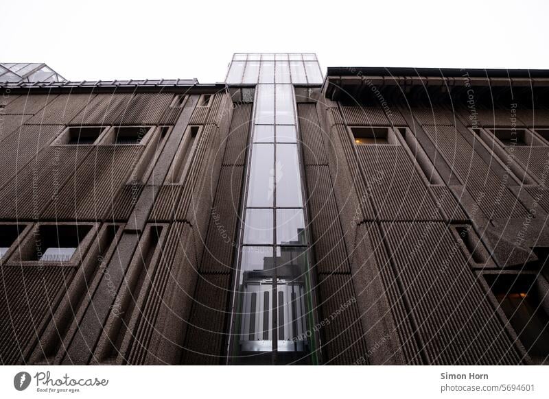 Impressive building façade with central glass elevator Facade Manmade structures Building impressive Large Structures and shapes Elevator Glass elevator