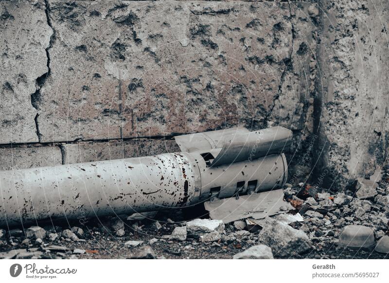 weapon rocket lying on the ground near the wall in Ukraine Donetsk Kherson Kyiv Lugansk Mariupol Russia Zaporozhye abandon abandoned air defense army attack