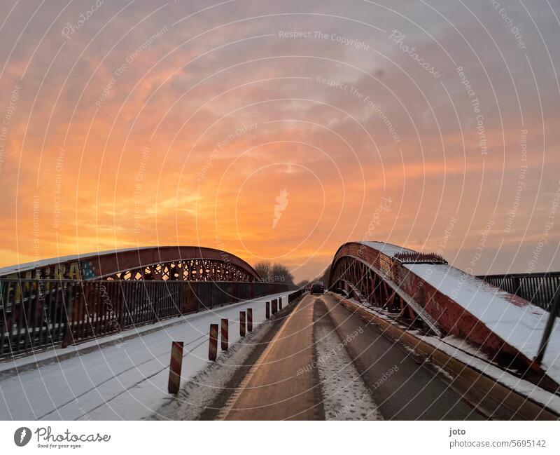 Snow-covered bridge with sunrise and wet road Lines and shapes Winter January February March Frost Tracks Structures and shapes Contrast Rich in contrast icily
