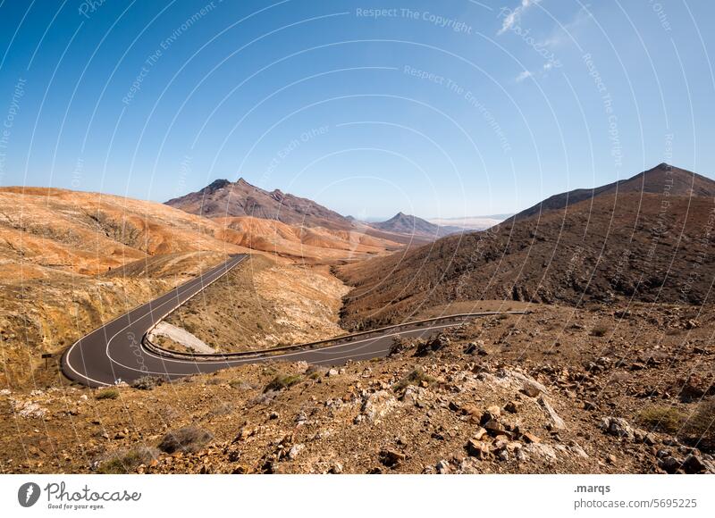 Dry country road Driving Street Mountain Beautiful weather Horizon Cloudless sky Landscape Nature Summer Freedom Adventure Trip Vacation & Travel Transport Day