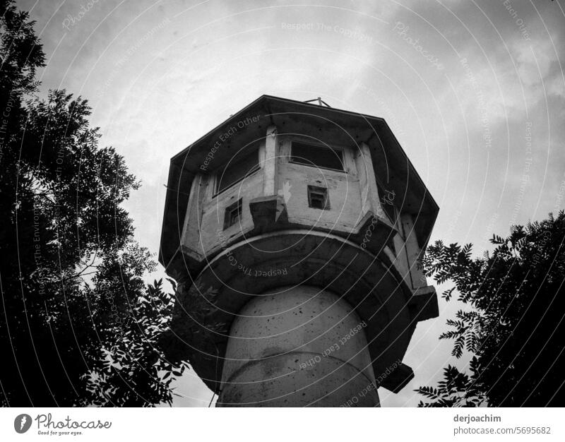 Historical monument: Old GDR watchtower in Berlin. Placed between trees. Watch tower Tower Architecture Deserted Manmade structures Landmark Sky Day Building