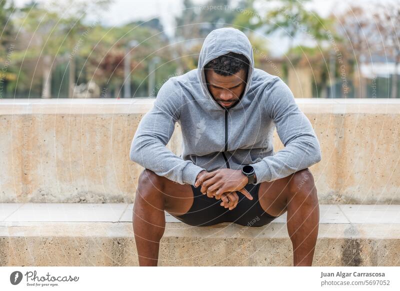Sad black sportsman resting after training athlete break melancholy depress failure pause stair sad upset tired male african american young ethnic afro