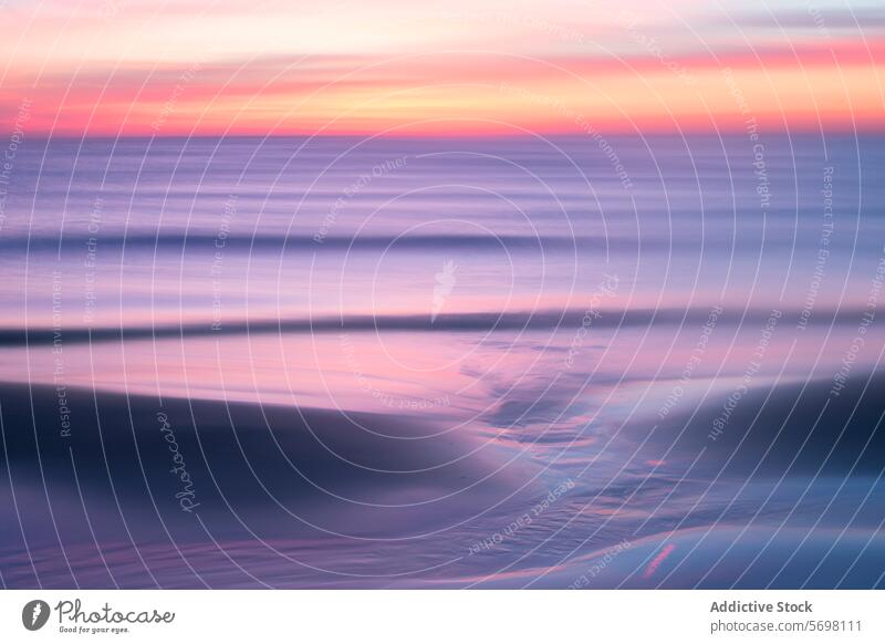 Ethereal pastel sunset over calm Mediterranean waters with gentle waves and soft reflections on the sand sea tranquil ethereal serene dusk twilight peaceful