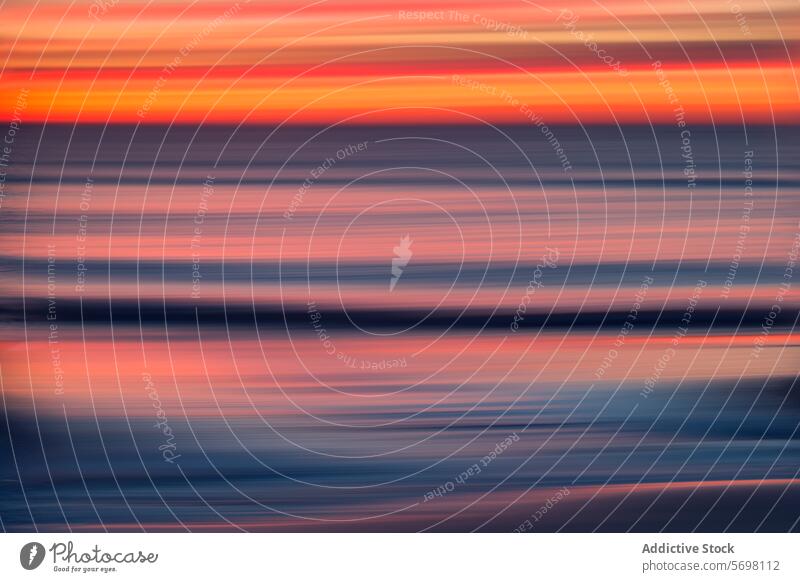 Abstract motion blur of a vibrant sunset with streaks of red and blue over the Mediterranean Sea abstract sea wave horizontal color pattern texture background