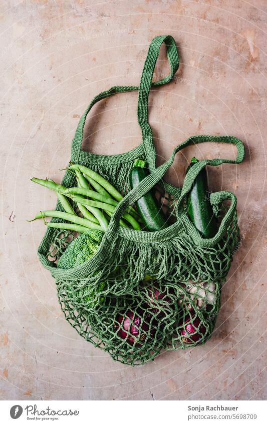 A green net shopping bag with fresh vegetables Vegetable Shopping bag Net Fresh Healthy Organic Eco-friendly Bag more vegan Food Reusable Cotton plant Lifestyle