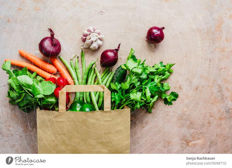 A paper shopping bag filled with fresh vegetables Vegetable Shopping bag Fresh Food Diet Paper Eco-friendly eco more vegan Onion Parsley plan Raw