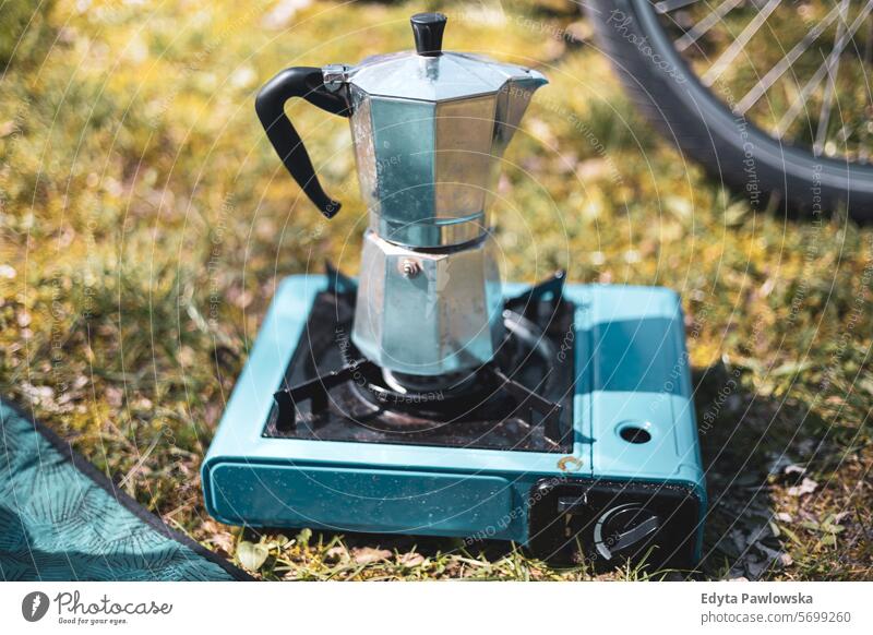 Making Espresso Coffee on Camping Gas camping stove close-up cooking day drink lifestyles nature non-urban outdoors coffee real life rural scene making coffee