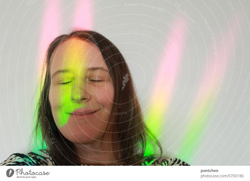 light in rainbow colors on a wall on a woman. Beam of light Rainbow Hope Joy Happy Light Tolerant Multicoloured Refraction Prismatic colour Prismatic colors