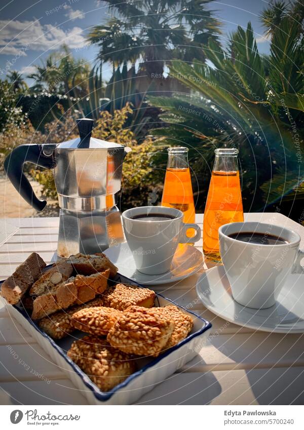 Italian pastries, coffee and sweet beverages sunny sunlight Sicily Italy day drink lifestyles nature outdoors terrace patio espresso coffee maker espresso maker