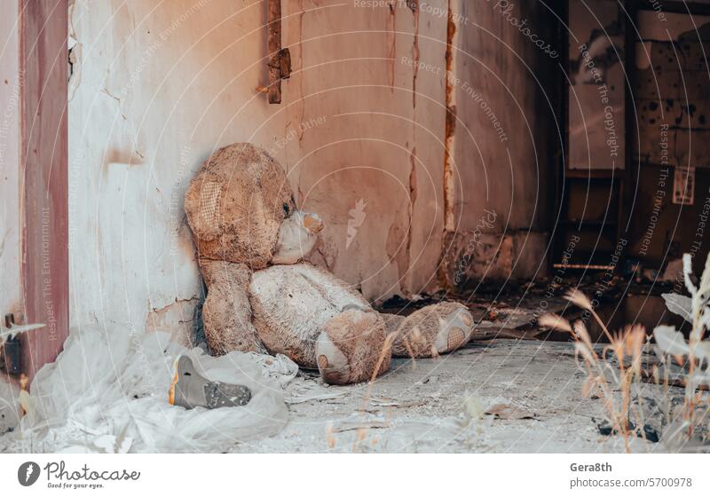 bear children's soft toy near the wall of a destroyed house in Ukraine Donetsk Kherson Kyiv Lugansk Mariupol Russia Zaporozhye abandon blown up bombardment