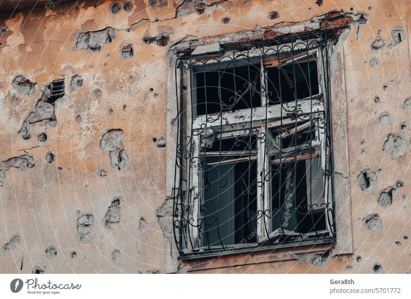 empty windows of a damaged house in Ukraine Donetsk Kherson Kyiv Lugansk Mariupol Russia Zaporozhye abandon abandoned attack bakhmut blown up bombardment broken