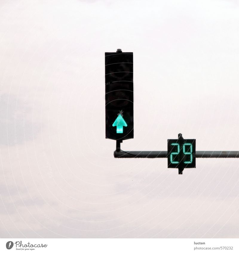 Traffic light on green with seconds counter in front of sky City trip Technology Clouds Town Traffic infrastructure Motoring Street Crossroads Road sign Metal