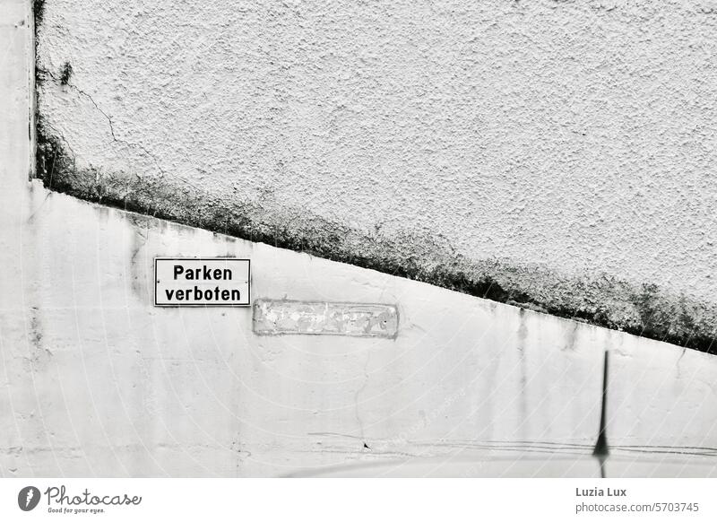 No parking - claim and reality keep Signage Signs and labeling Reckless interdiction parking car Parking Clue sign house wall ignored Ignorance White Gray