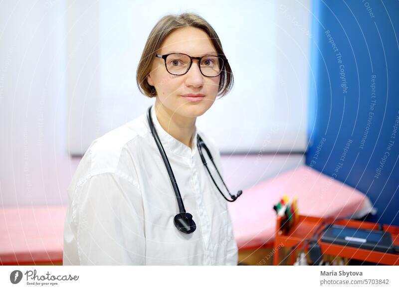 Portrait of female doctor cardiologist during appointment of patient. Cardiology consultation and treatment of heart diseases portrait glasses stethoscope woman