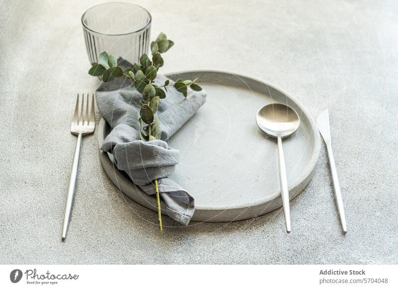 Elegant Table Setting with Natural Decor Elements table setting elegant modern gray napkin cutlery greenery stone charger plate decor natural minimalist design