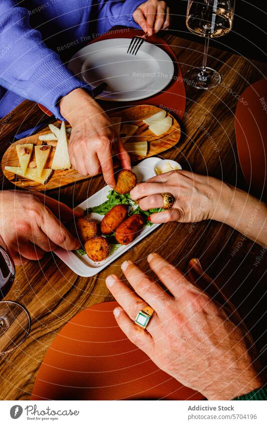 Sharing tapas with friends at a cozy dinner setting food sharing gathering plate eating company dinner table restaurant meal cuisine appetizer social