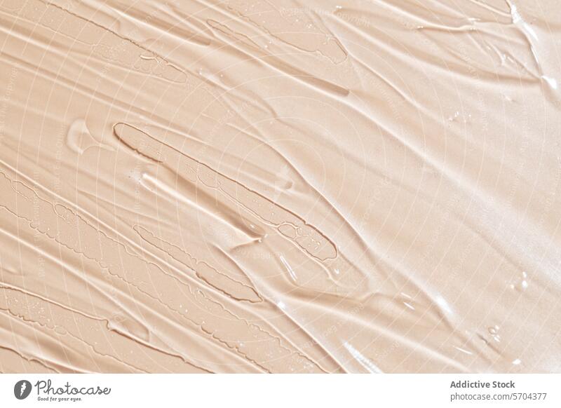 Close-up texture of creamy beige foundation makeup smear close-up cosmetic beauty product skin tone skincare moisturizer liquid swatch macro detail luxury